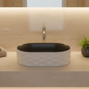 Bathroom sink with towels and a plant on a wooden surface