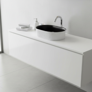 Black oval sink with textured white base on a white background